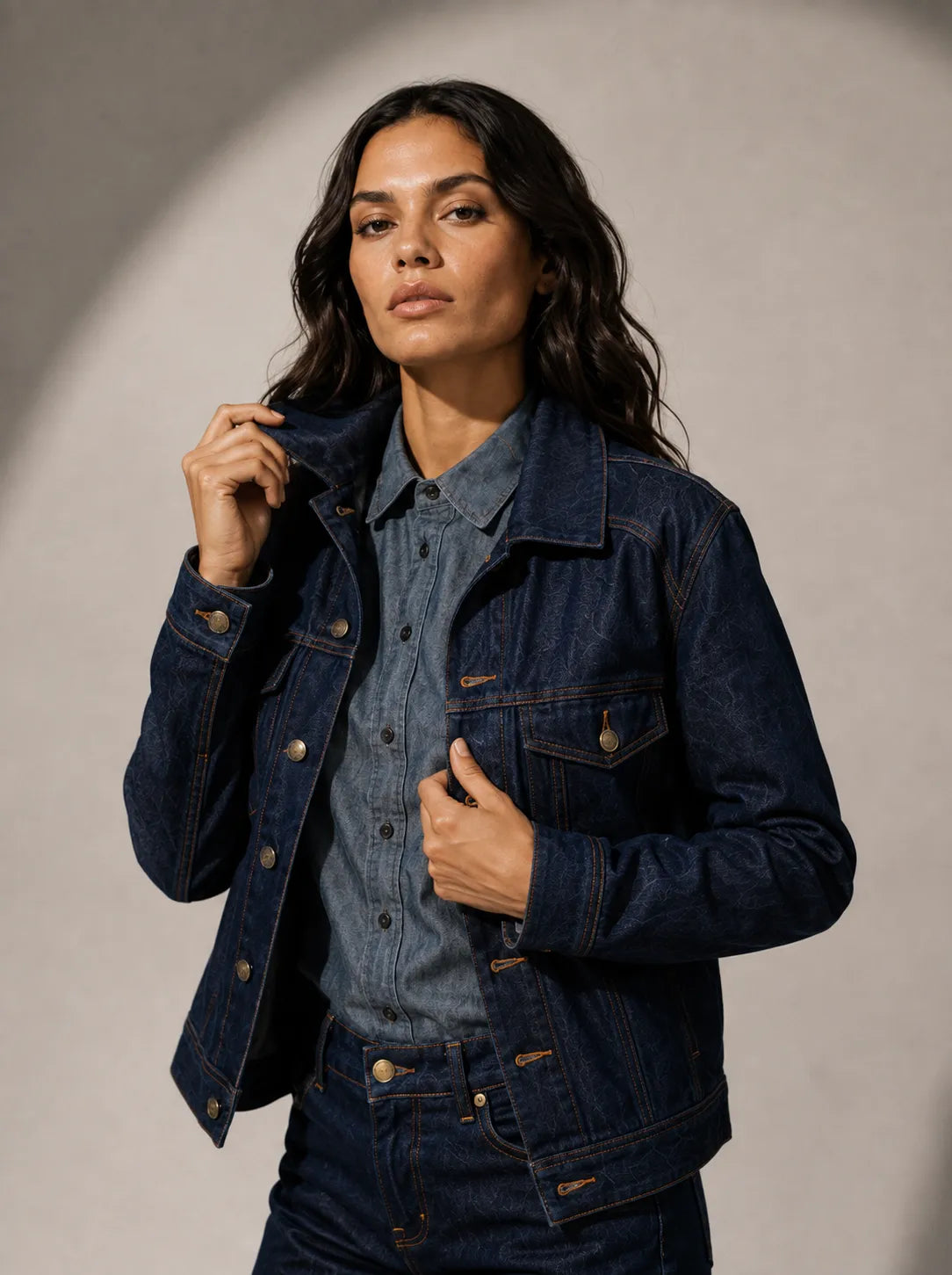 Lover Boy Jean Jacket in black — full length against a curved concrete wall.