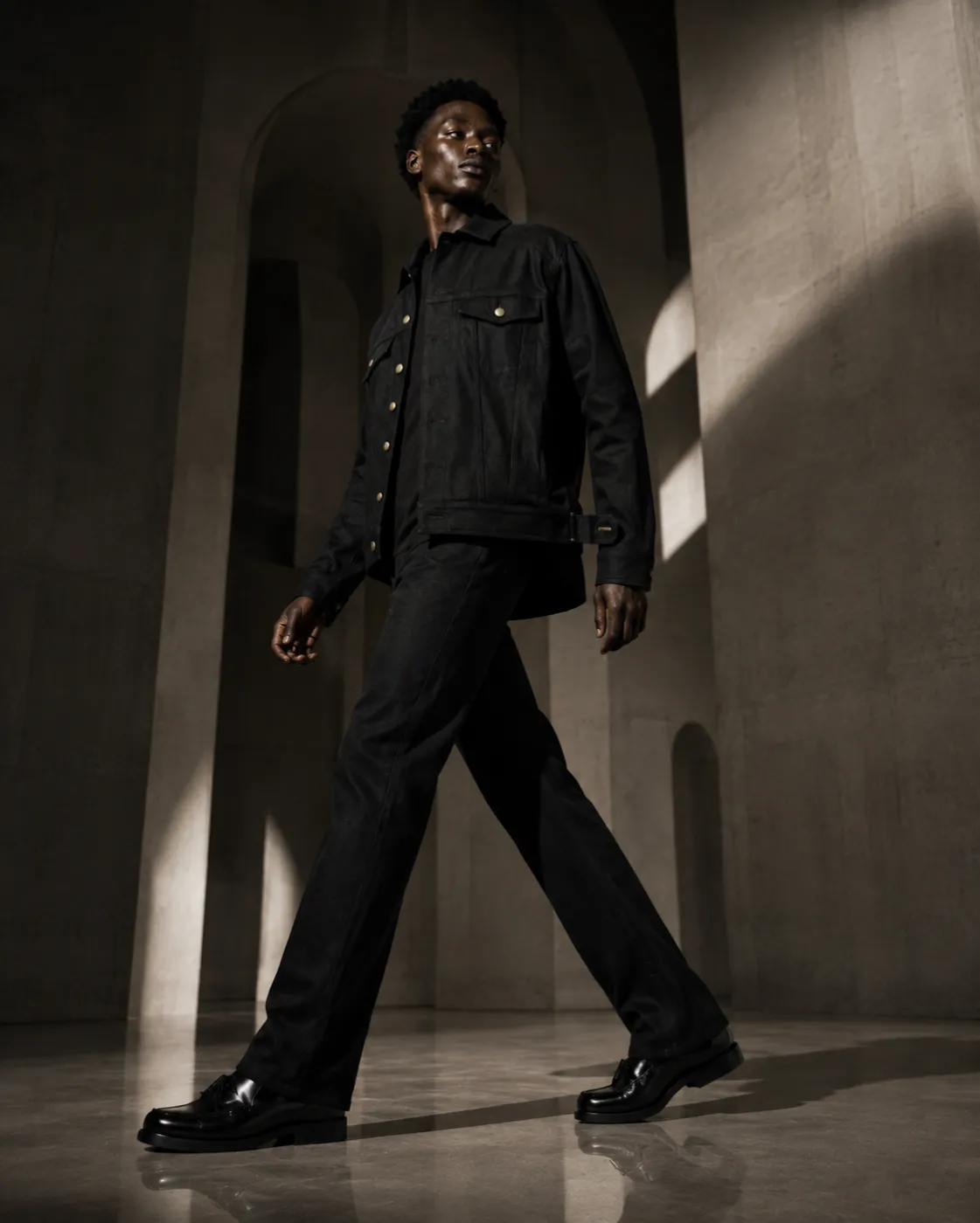 The Uniform in black — jeans, full length.