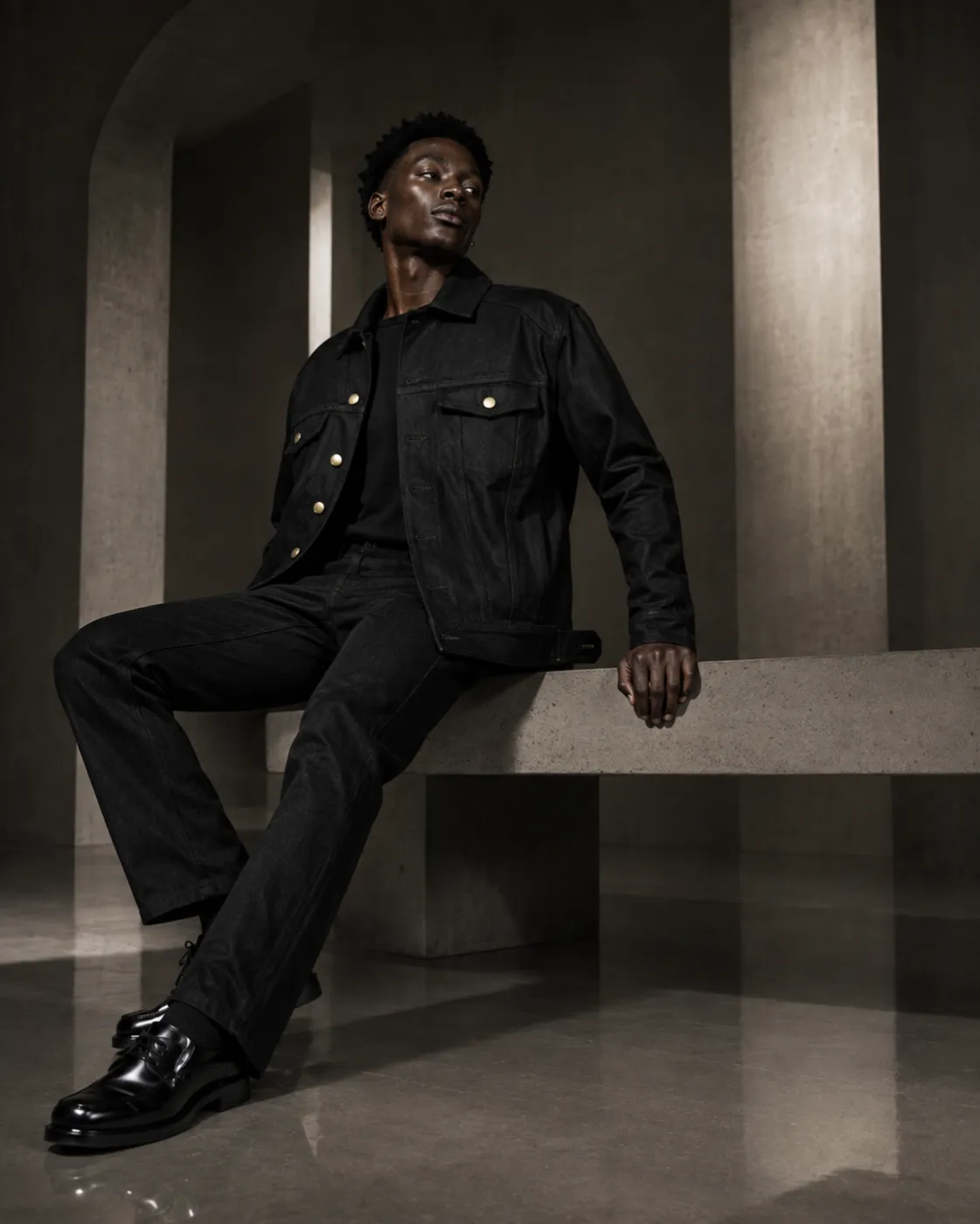 The Uniform in black — seated.